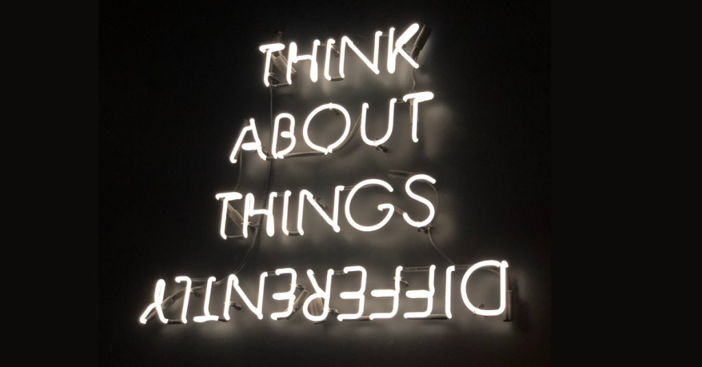 Neon lights that say 'Think about things differently'