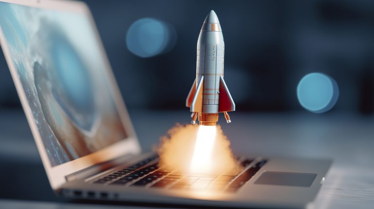 A small rocket takes off from a laptop